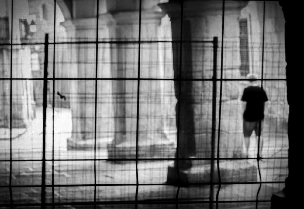 Man Behind City Grid by Milena Seita — canvas wall art