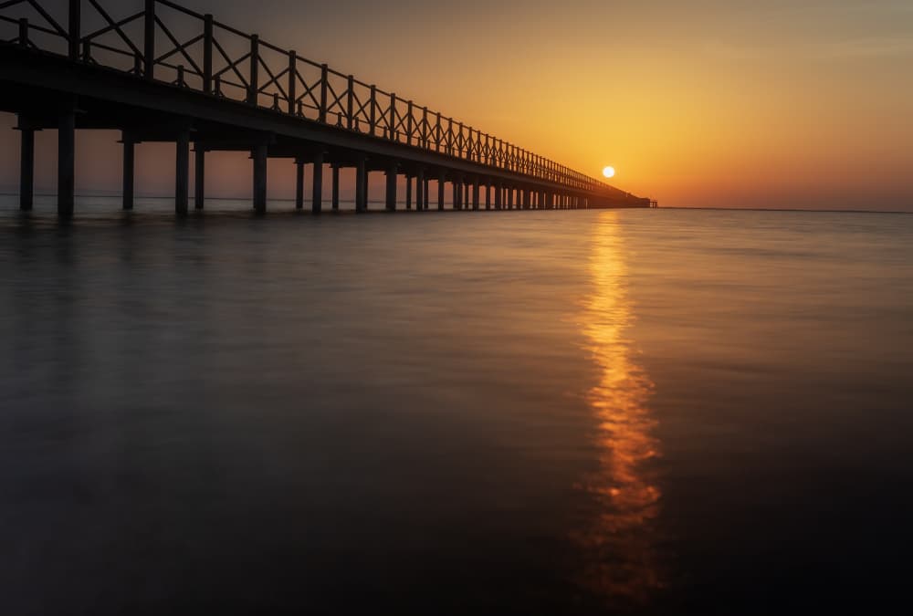 Tranquil Sunset Pier by Bassant Meligy — canvas wall art