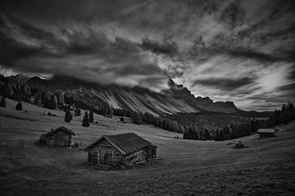 Moody Mountain Cabins by Radek Pohnan — canvas wall art