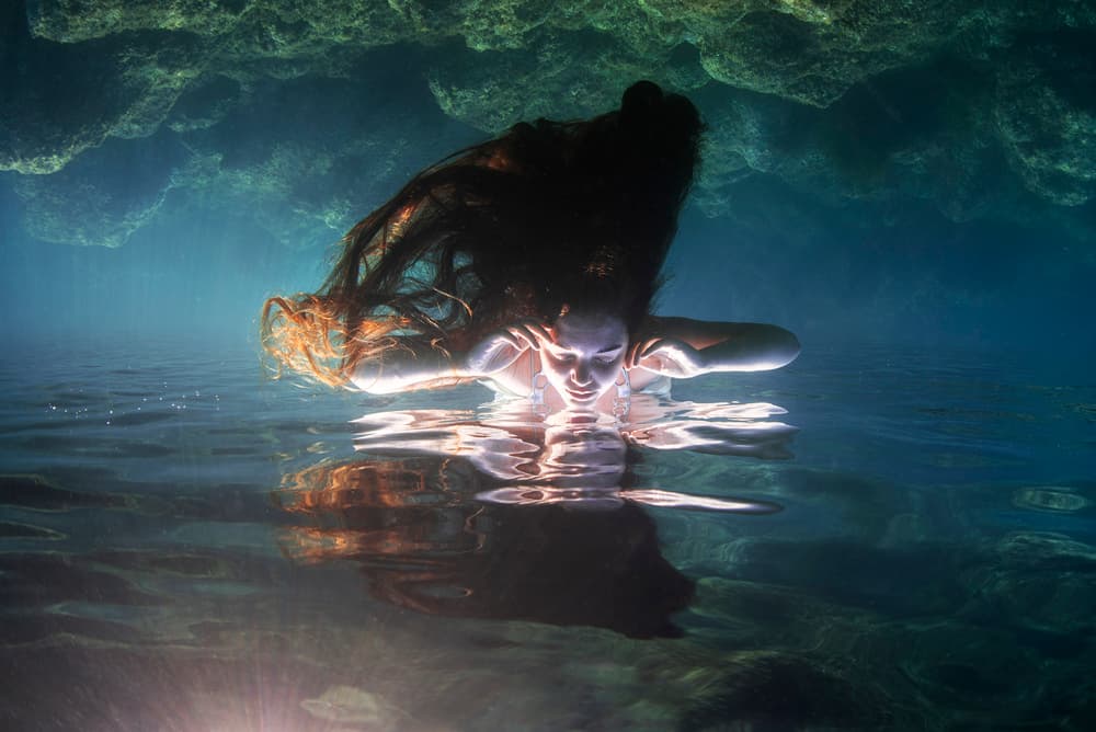 Glowing Woman Underwater by Davide Lopresti — canvas wall art