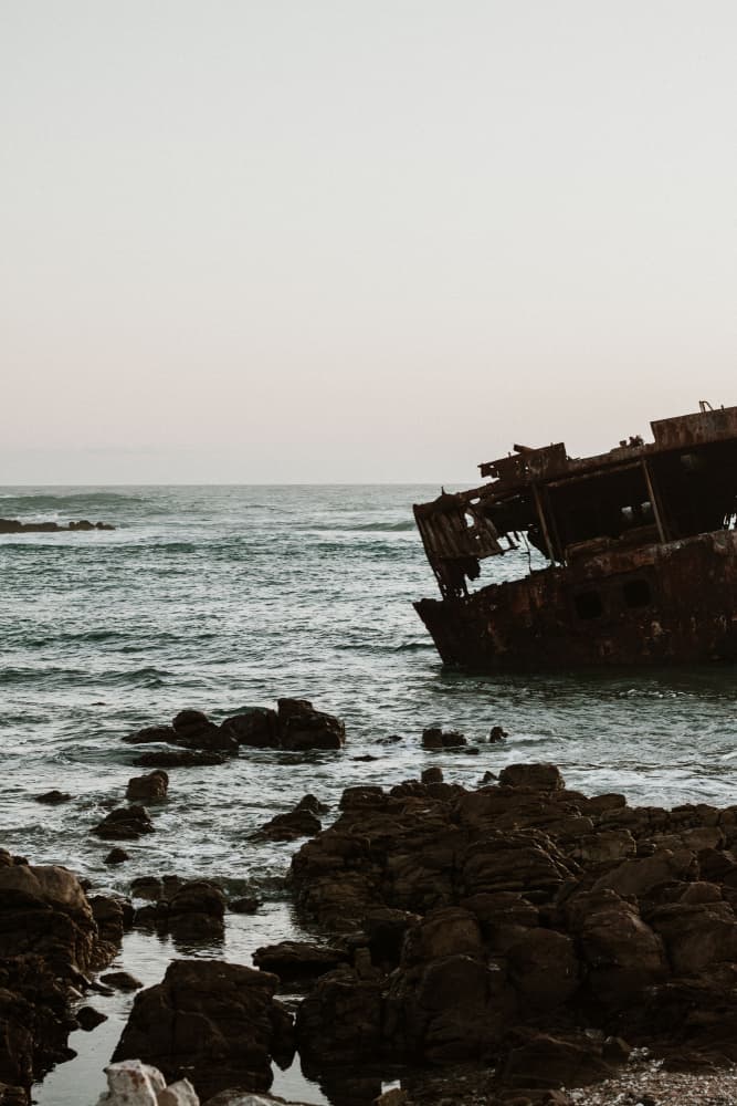 Rusty Shipwreck Coast by Megan Shone — canvas wall art