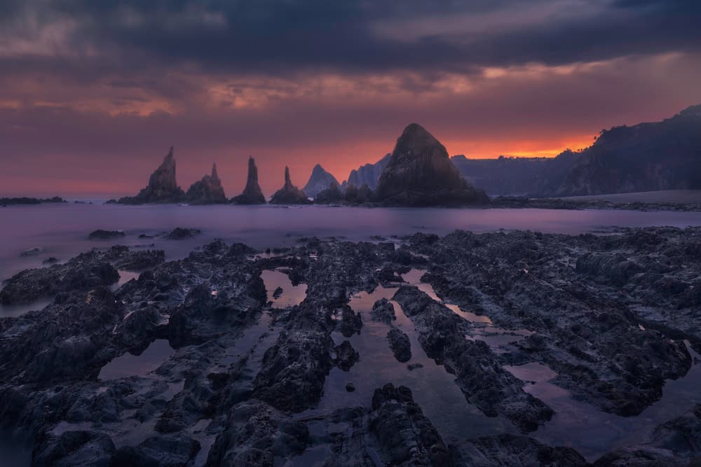 Purple Sunset Sea Stacks by Alejandro Garcia — canvas wall art