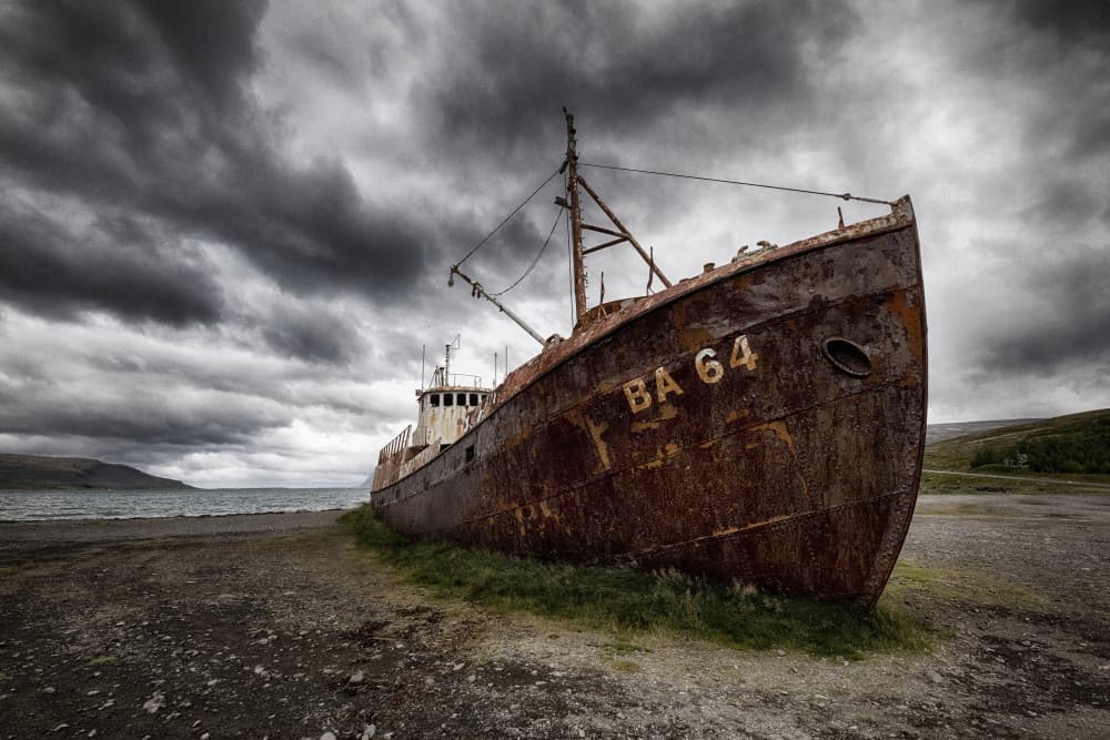 Rusty Shipwreck On Shore by Þorsteinn H. Ingibergsson — canvas wall art