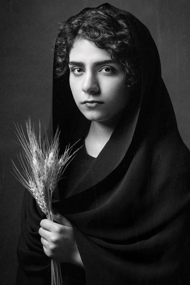 Young Woman Holding Wheat by Amir Heydari — canvas wall art