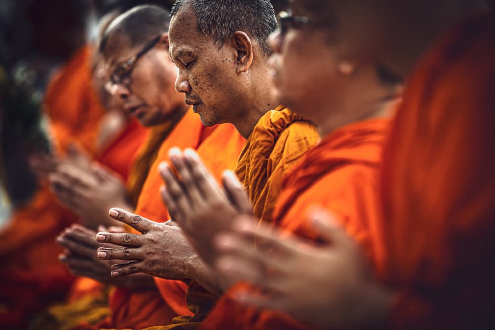 Buddhist Monks Meditate by Marco Tagliarino — canvas wall art