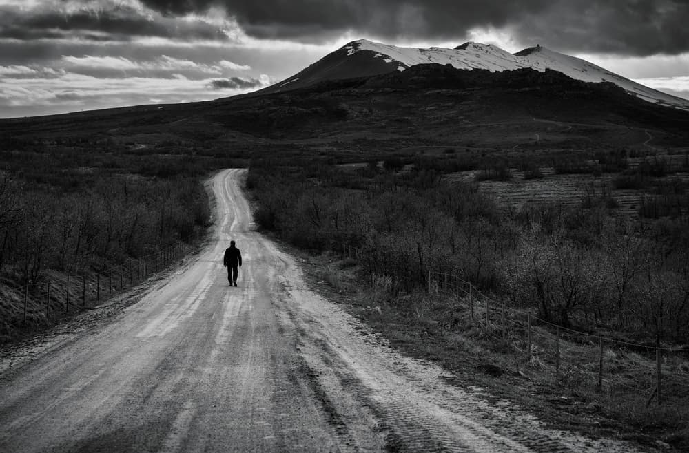 Lone Figure Mountain Road by Yavuz Pancareken — canvas wall art