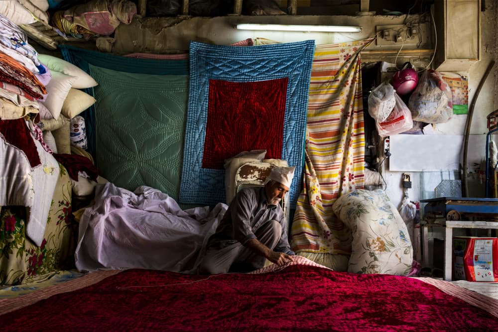 Traditional Fabric Merchant by Mohadese Gholami — canvas wall art