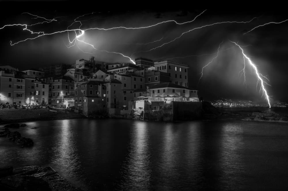 Lightning Strikes Coastal Town by Alessandro Traverso — canvas wall art