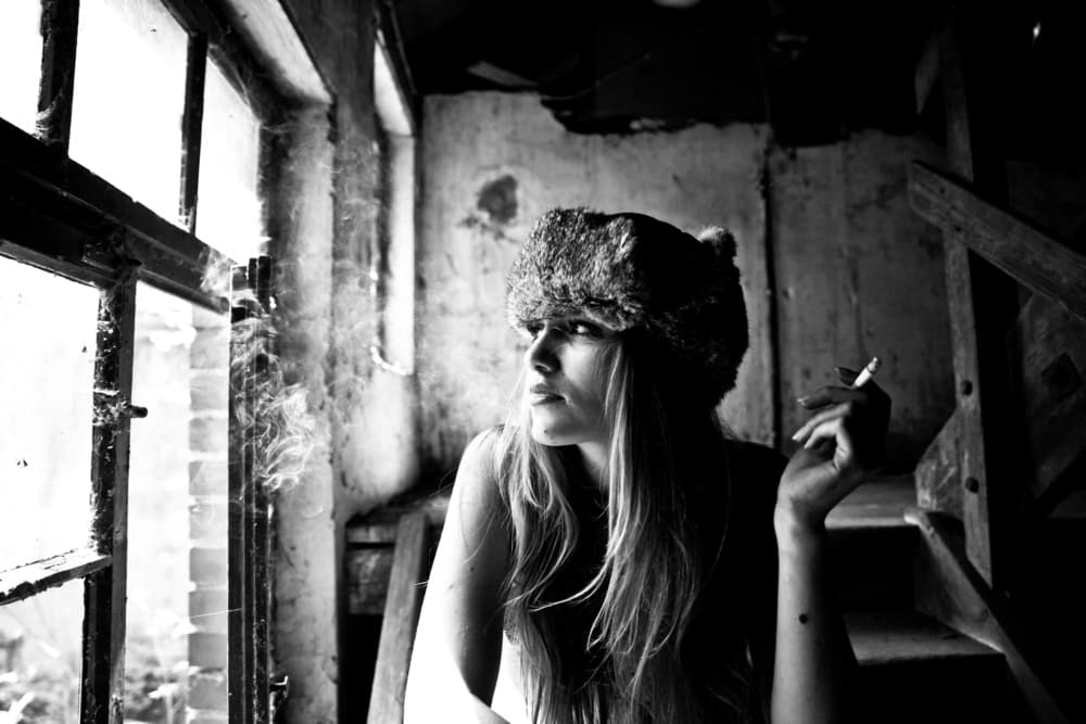 Pensive Woman Fur Hat by Erkan Camlilar — canvas wall art