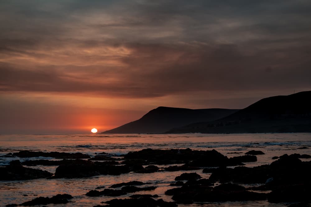 Dramatic Coastal Sunset by Tim Mossholder — canvas wall art