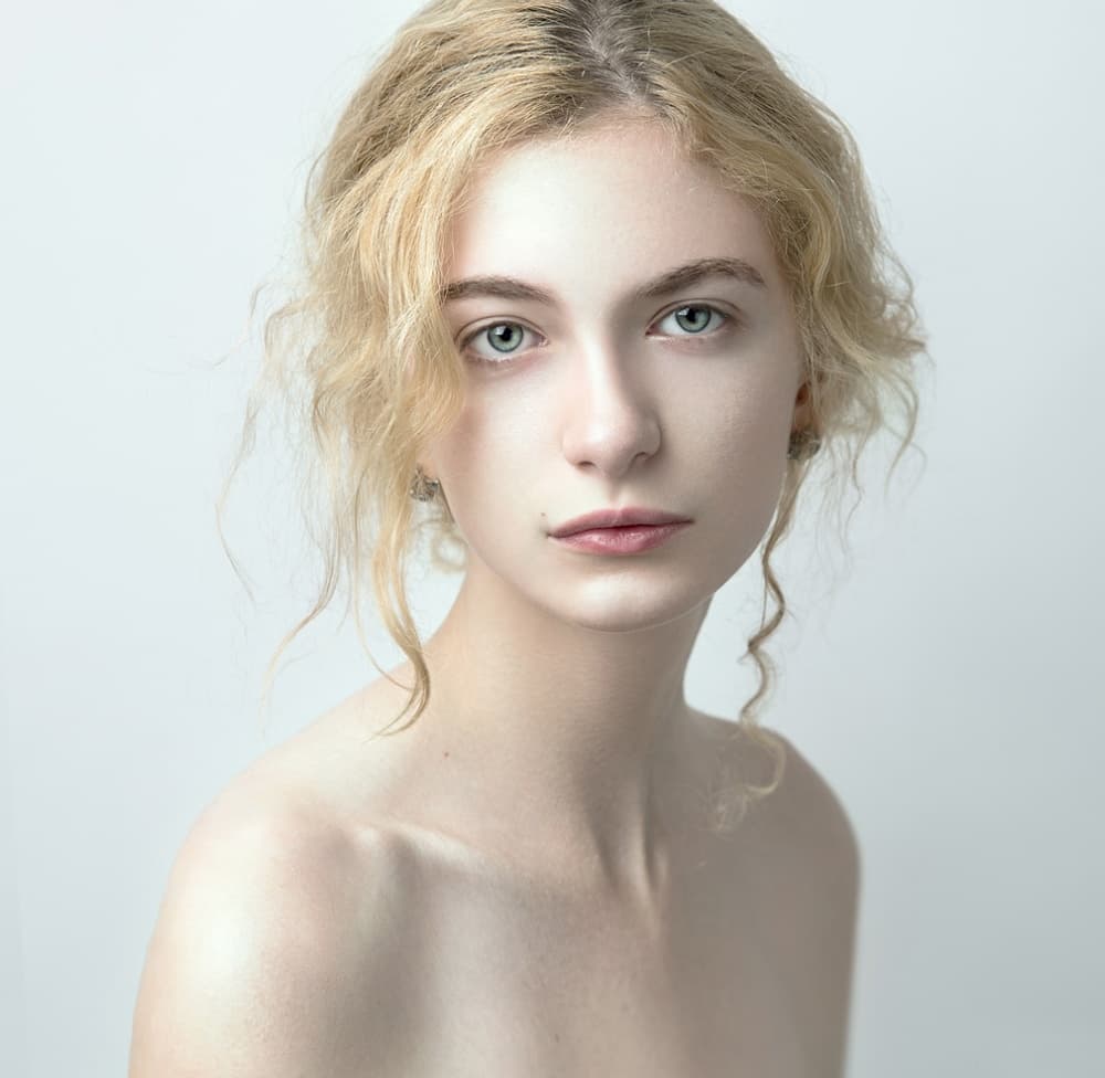 Serene Blonde Portrait by Danil Rudoi — canvas wall art