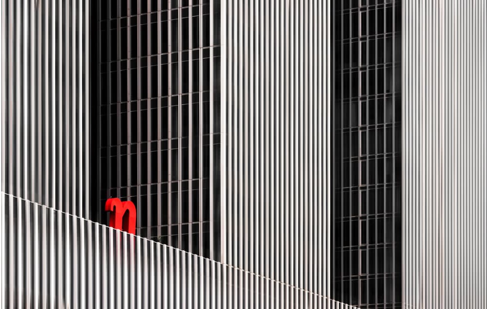 Red M Geometric Facade by Hans-Wolfgang Hawerkamp — canvas wall art