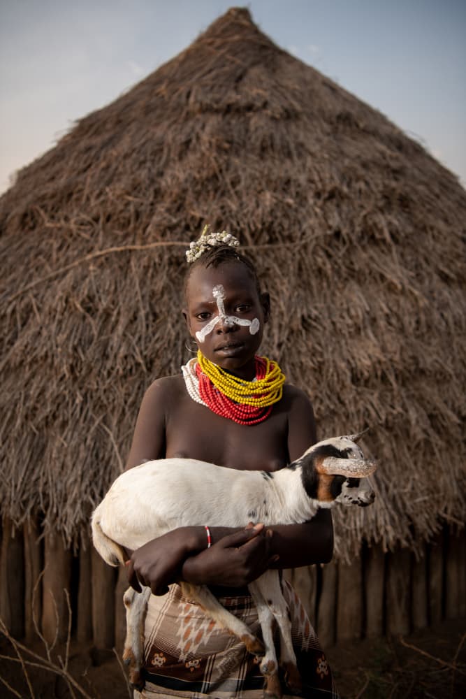 Village Child with Goat by Max Vere-Hodge — canvas wall art