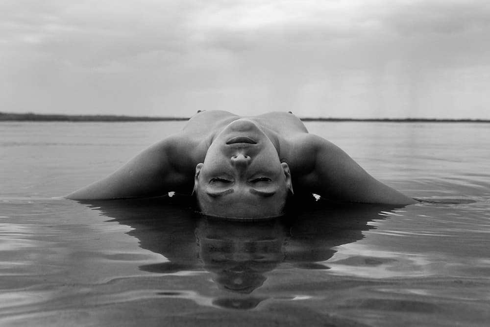 Floating in Calm Water by Mikhail Faletkin — canvas wall art