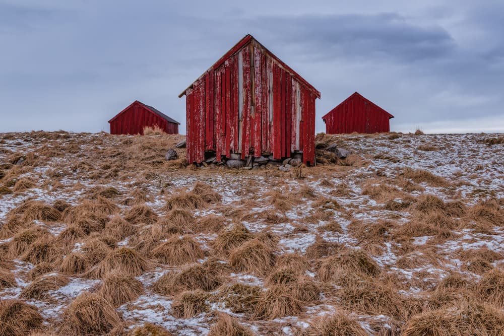 Rustic Red Winter Cabins by erwin hodister — canvas wall art