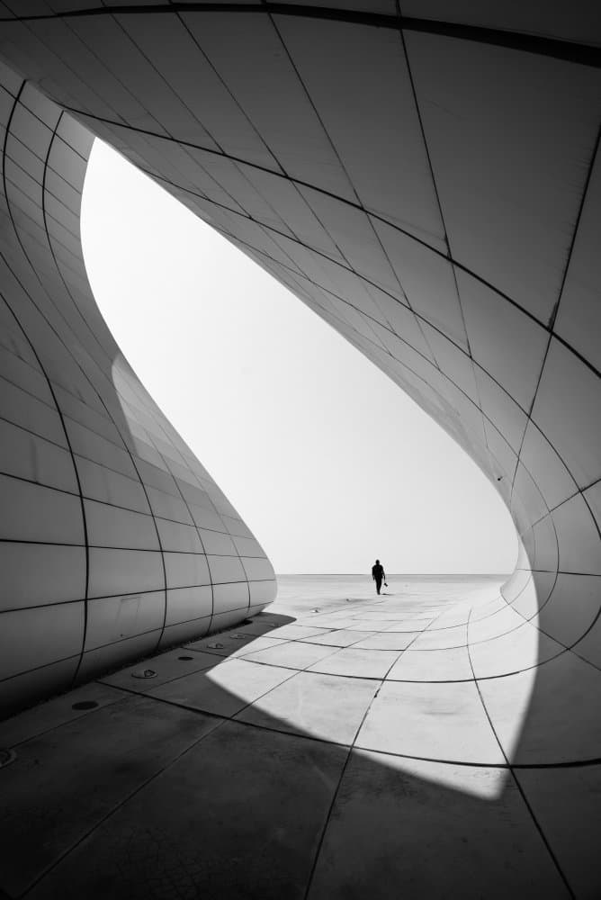 Architectural Curves Lone Figure by Hasan Shaboot — canvas wall art