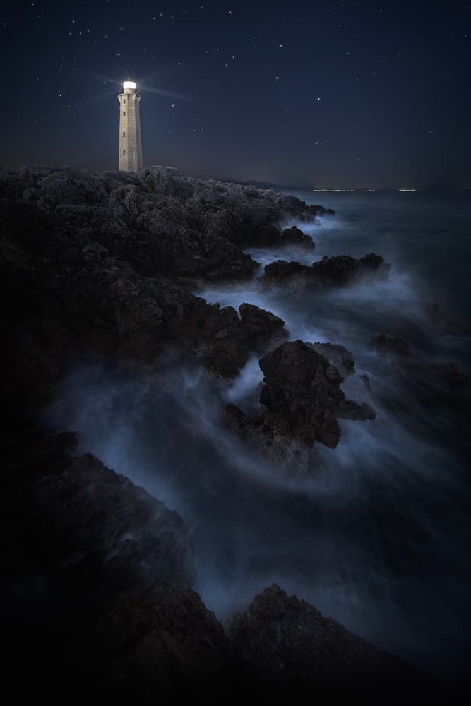 Lighthouse Under Starry Night by Chris Kaddas — canvas wall art