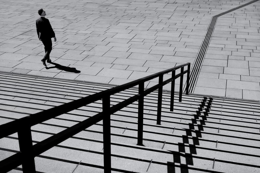 Man And Geometric Shadows by Rolf Endermann — canvas wall art