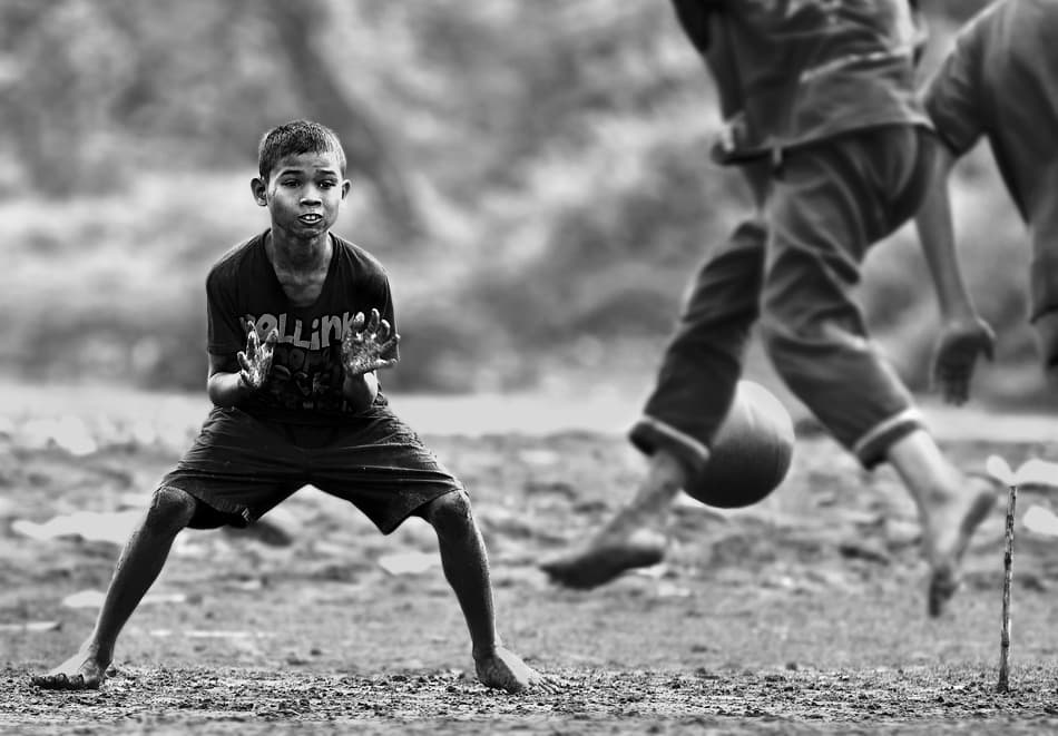 Barefoot Soccer Intensity by Sebastian Kisworo — canvas wall art