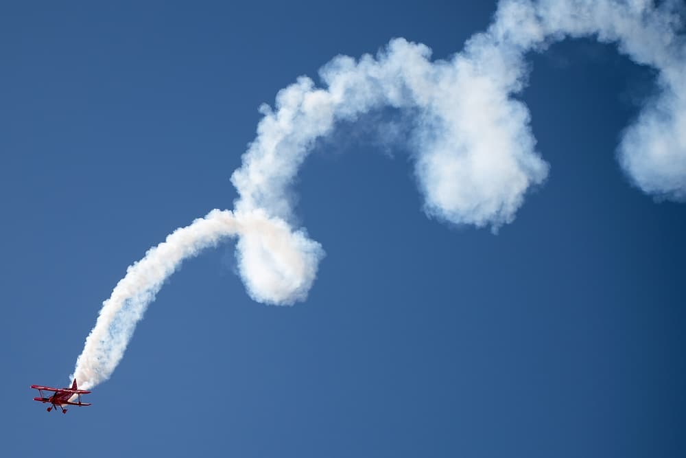 Red Biplane Aerobatics by David H Yang — canvas wall art