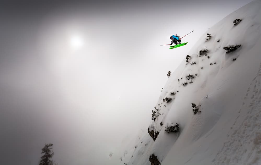 Skier Soaring Over Snow by Sandi Bertoncelj — canvas wall art