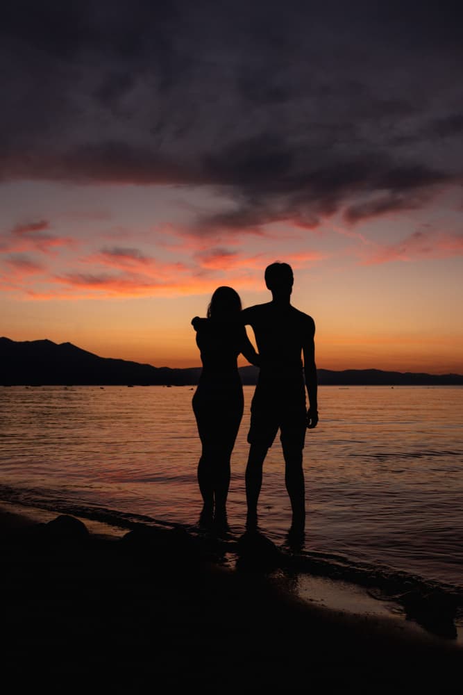 Sunset Beach Couple by Tim Mossholder — canvas wall art