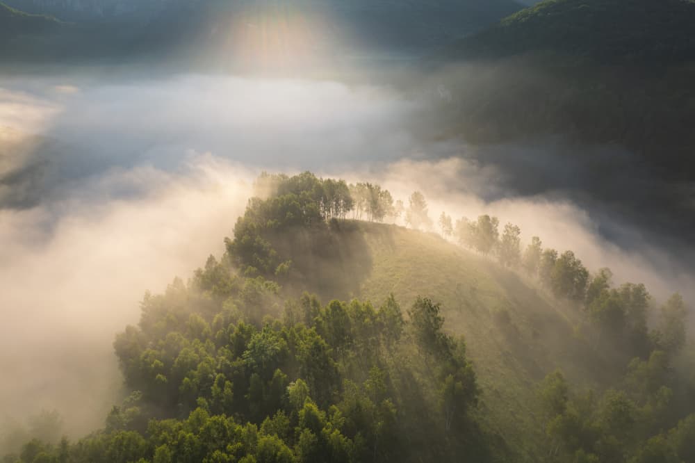 Sunlit Foggy Hills by Alexandru Ionut Coman — canvas wall art