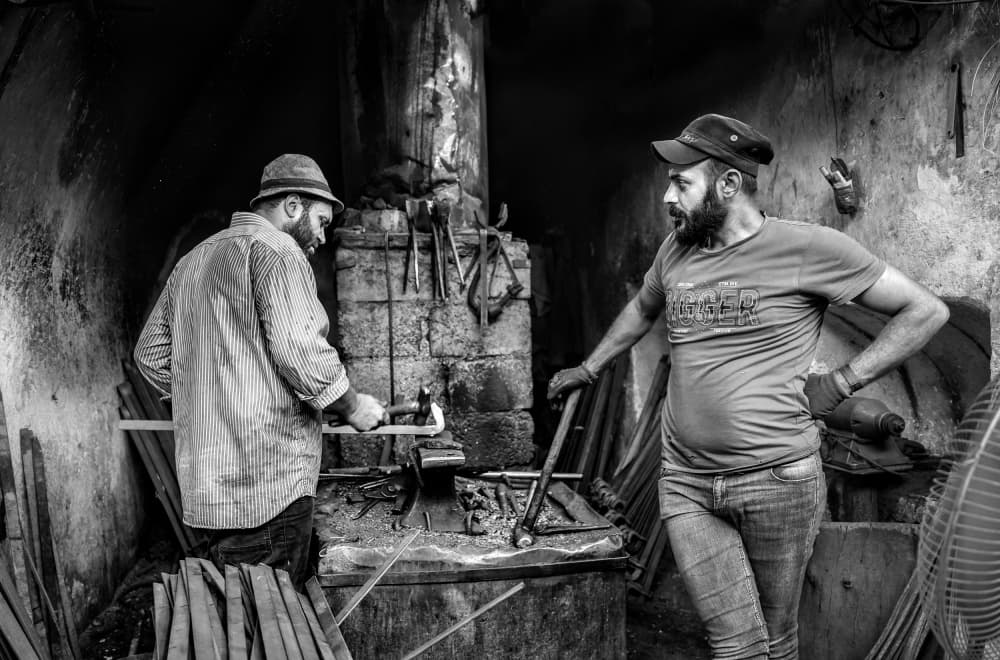 Blacksmiths at Forge by Bashar Alsofey — canvas wall art
