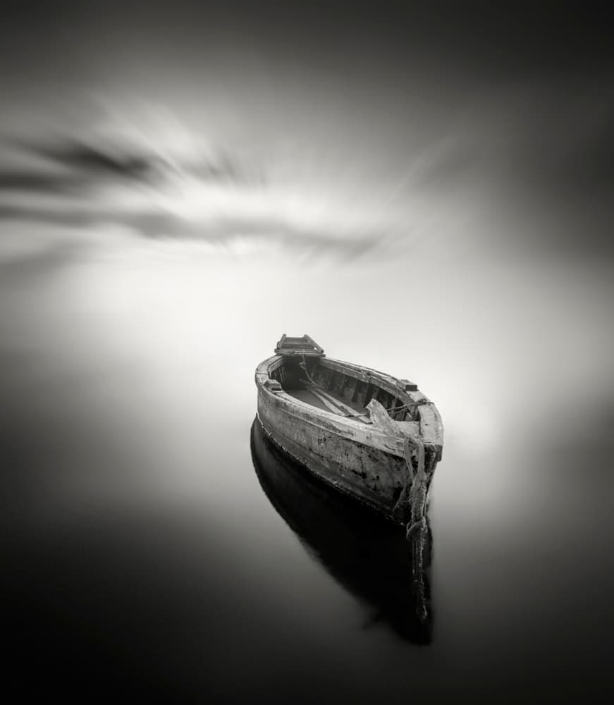 Old Boat Calm Waters by Joaquin Guerola — canvas wall art