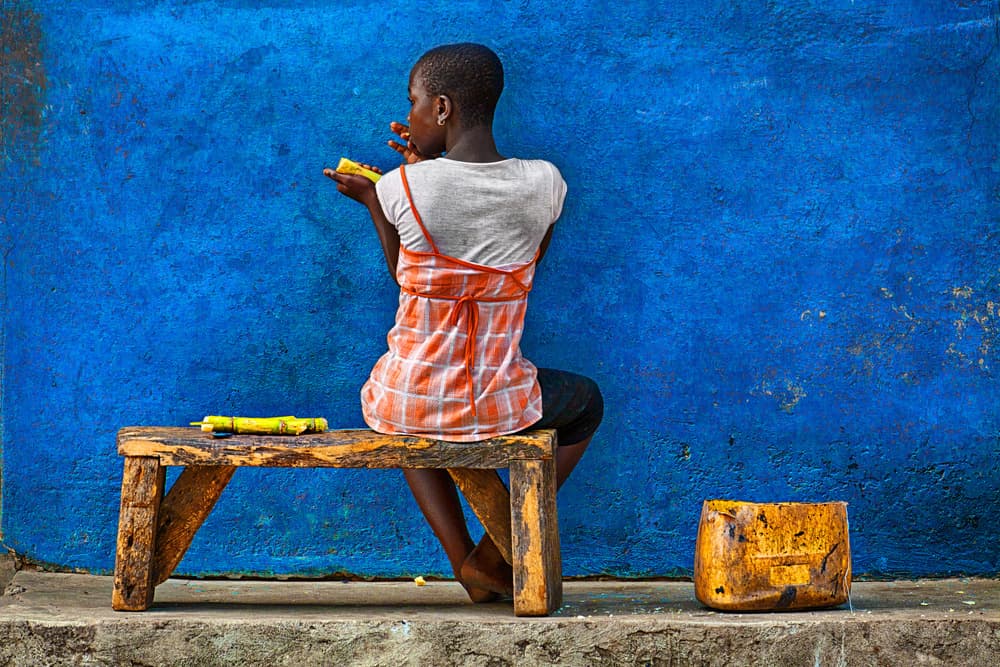 Girl Against Blue Wall by Sergio Pandolfini — canvas wall art