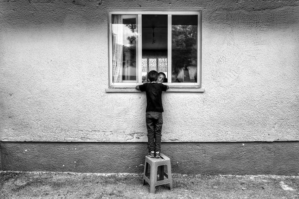 Curious Boys At Window by Ali Ayer — canvas wall art