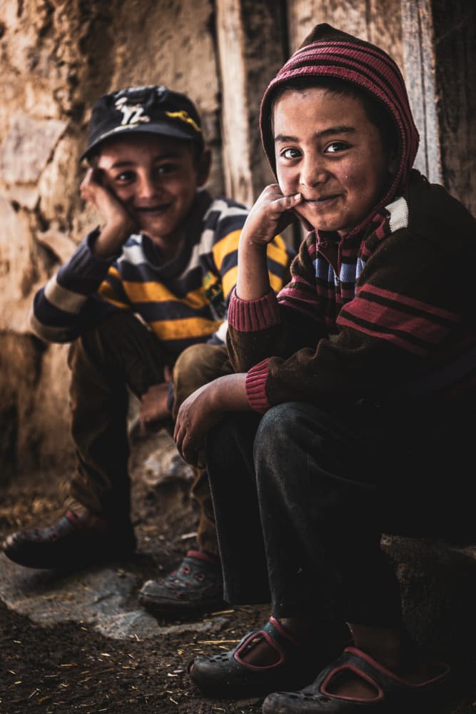 Smiling Village Kids by Marco Tagliarino — canvas wall art