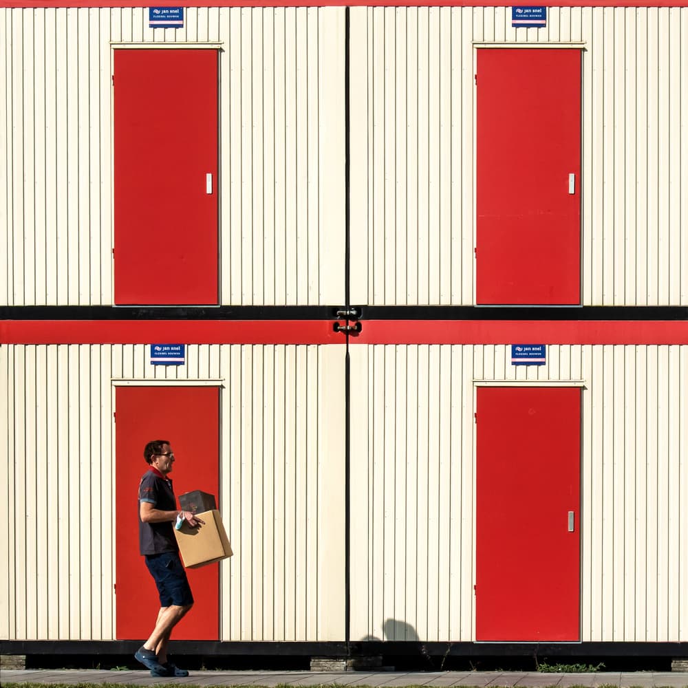 Man by Red Doors by Lus Joosten — canvas wall art