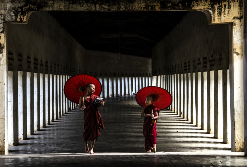 Red Umbrellas Temple Walk by Ajit Rana — canvas wall art