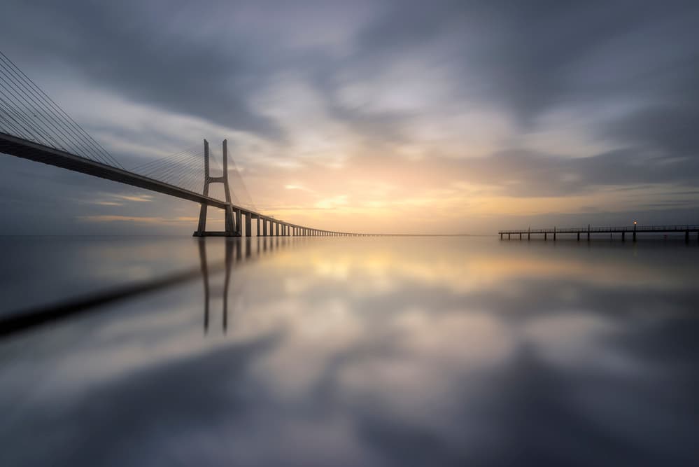 Serene Bridge Sunset by Jorge Ruiz Dueso — canvas wall art