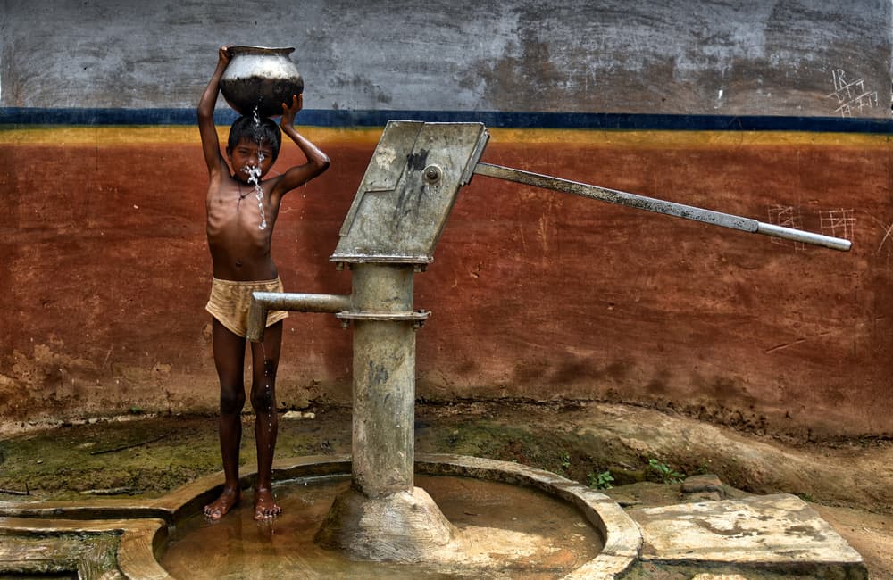 Indian Boy Water Pot by Avishek Das — canvas wall art