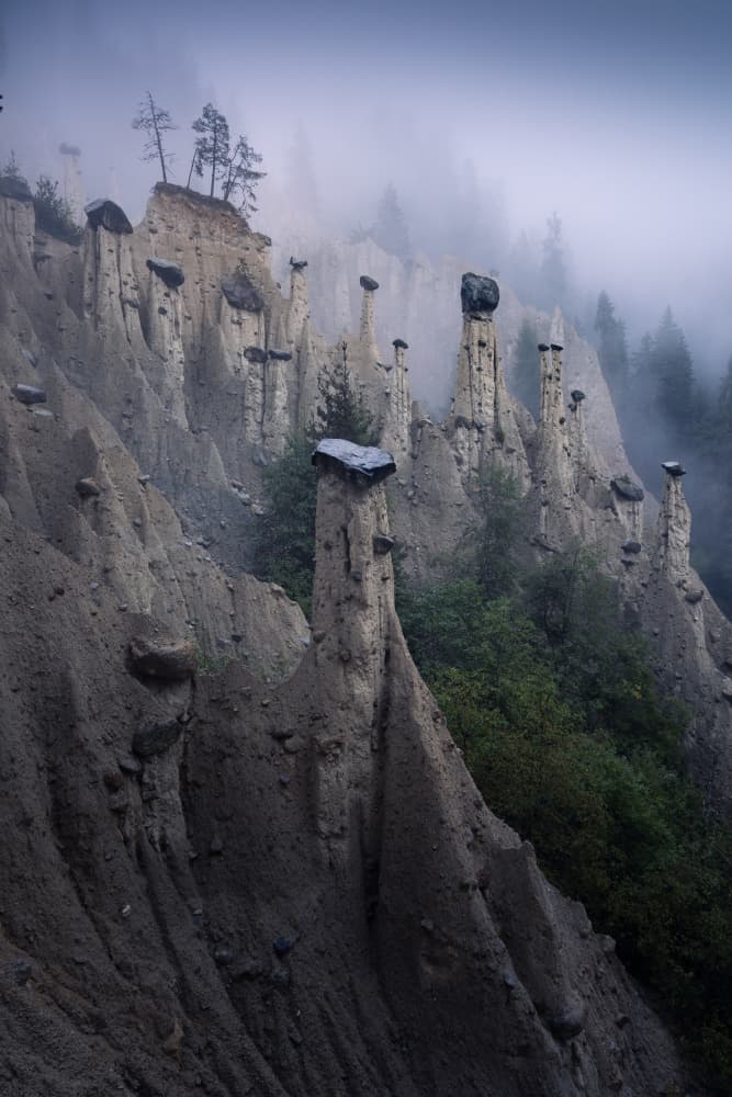 Misty Earth Pillars by Karol Nienartowicz — canvas wall art