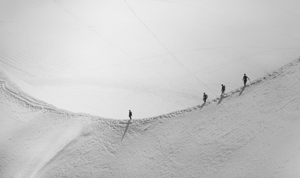 Hikers on Snowy Ridge by Elena Raceala — canvas wall art
