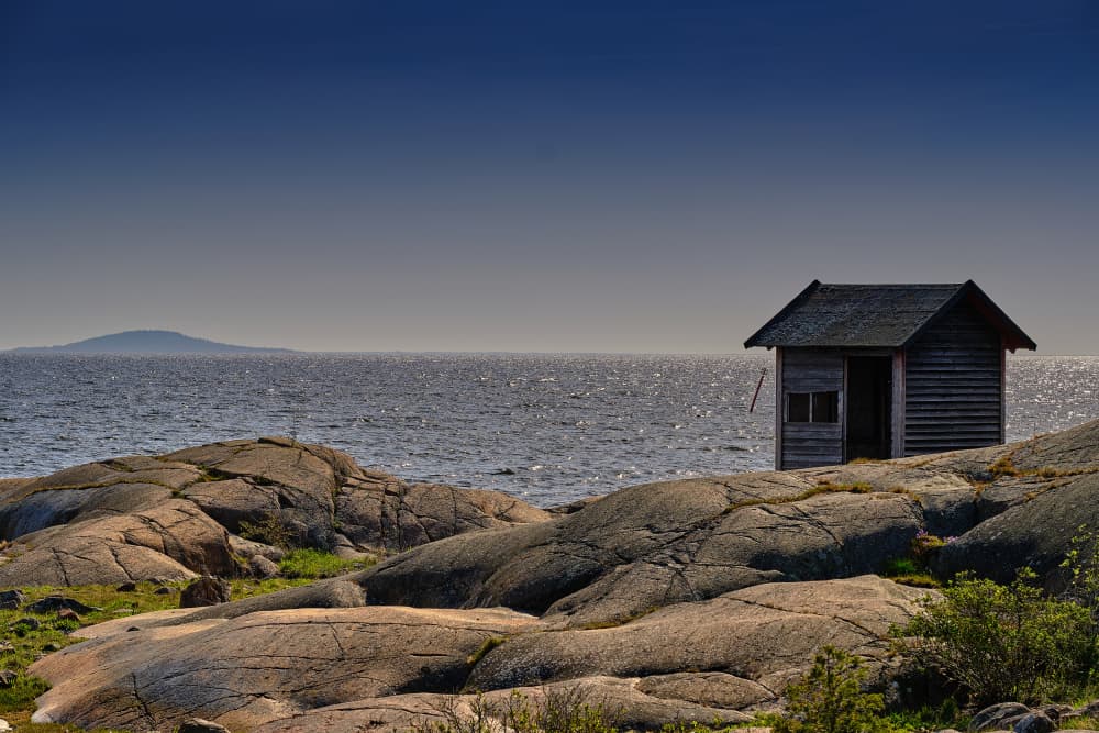 Rocky Coast Shack by Geertjan Plooijer — canvas wall art