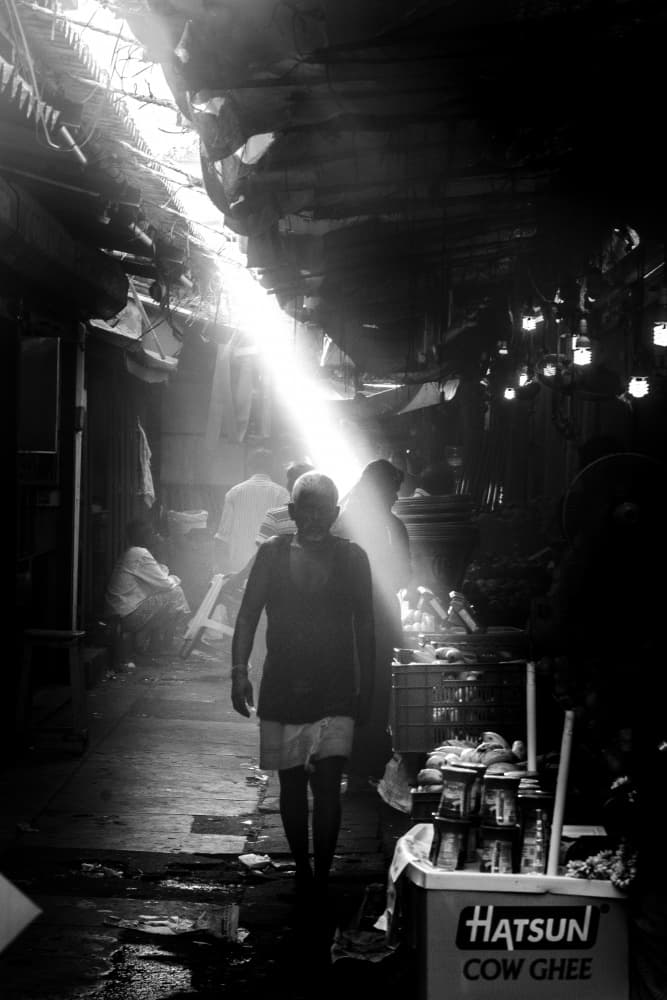 Man in Market Light by Ilan Amihai — canvas wall art