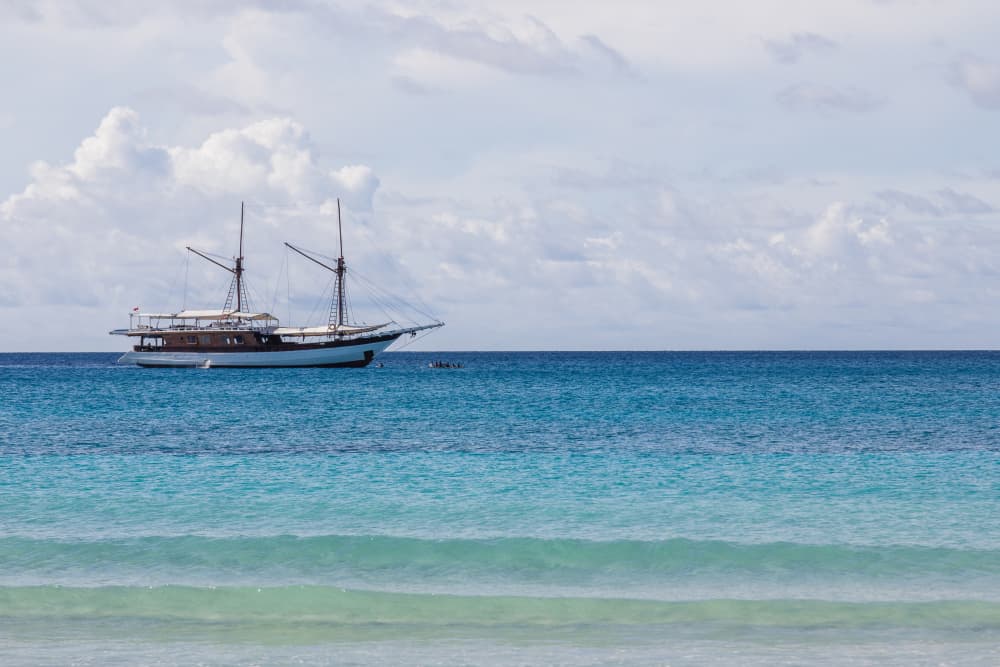 Sailboat on Turquoise Waters by Photolovers — canvas wall art