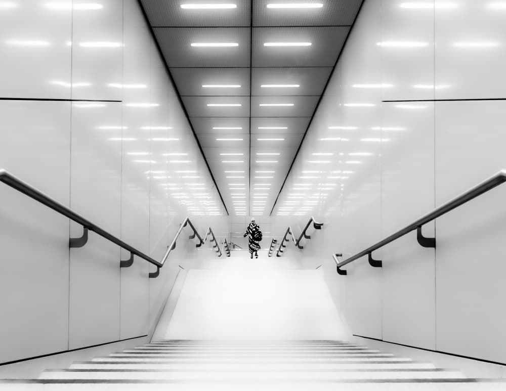 Lone Figure Descending Stairs by Andy Dauer — canvas wall art