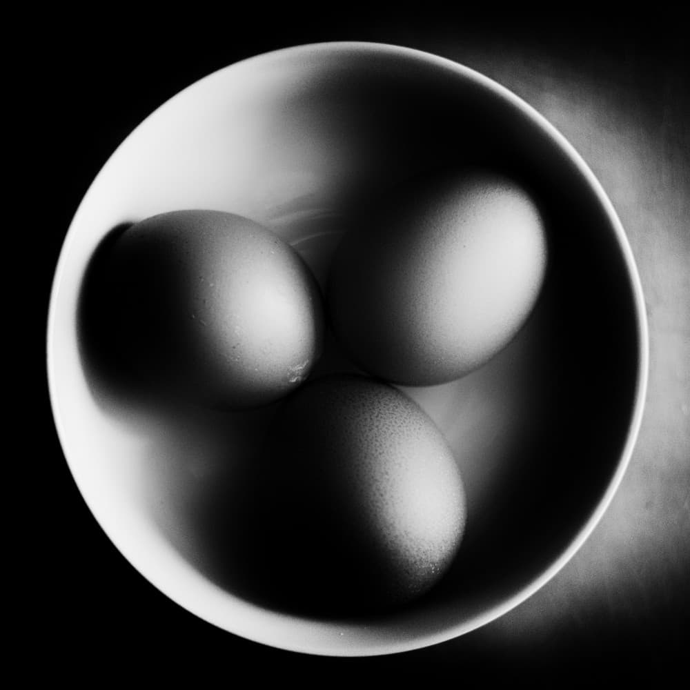 Monochrome Bowl Eggs by Andrea Di Bello — canvas wall art