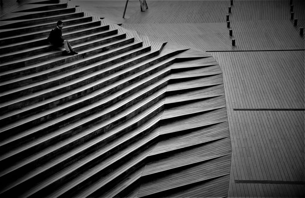 Man on Geometric Stairs by Reiko kiri — canvas wall art