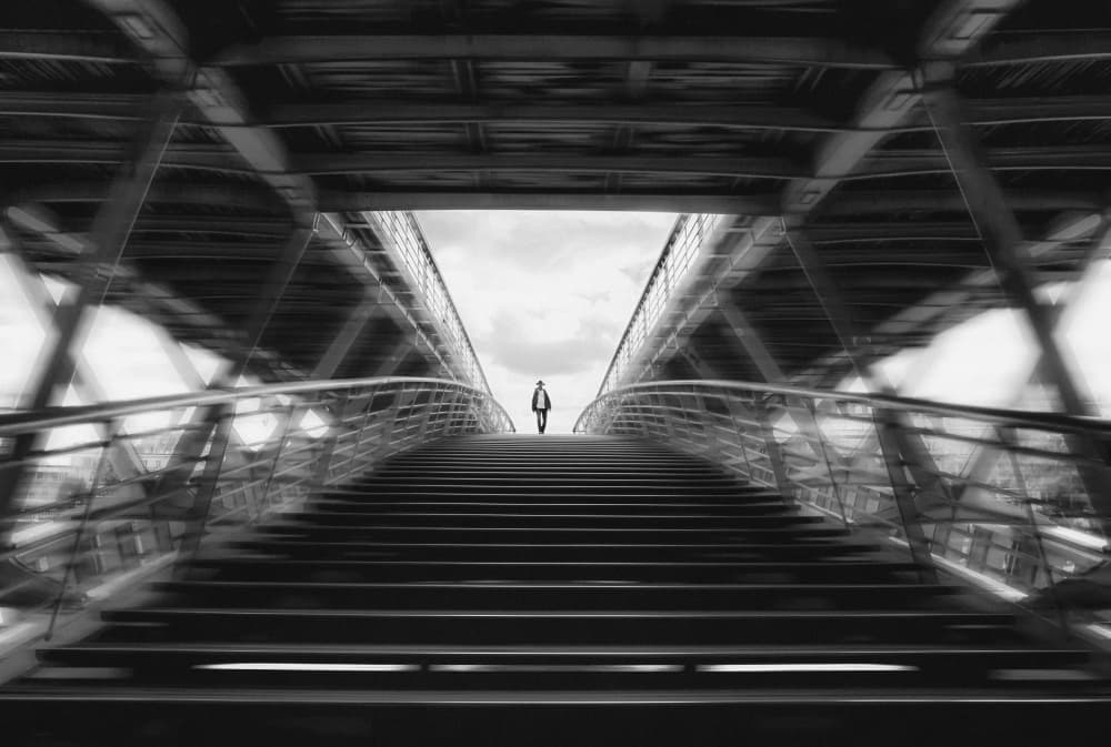 Lone Man Ascending Bridge by Leah Guo — canvas wall art
