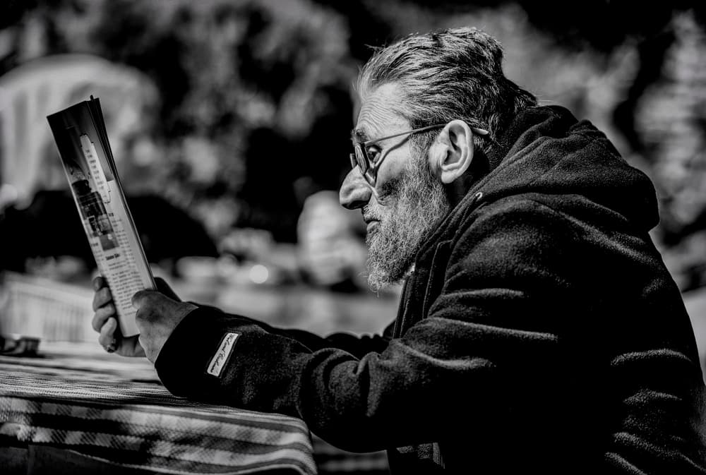 Thoughtful Man Reading by Ömer Ates Kızıltug — canvas wall art