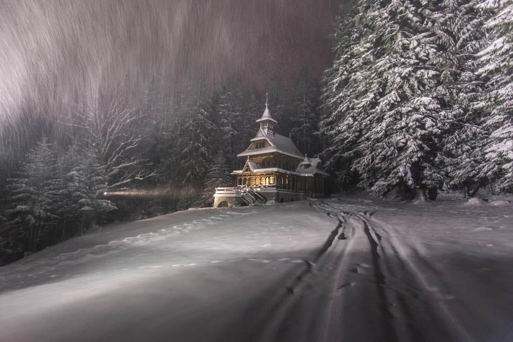Snowy Chapel Night by Karol Nienartowicz — canvas wall art