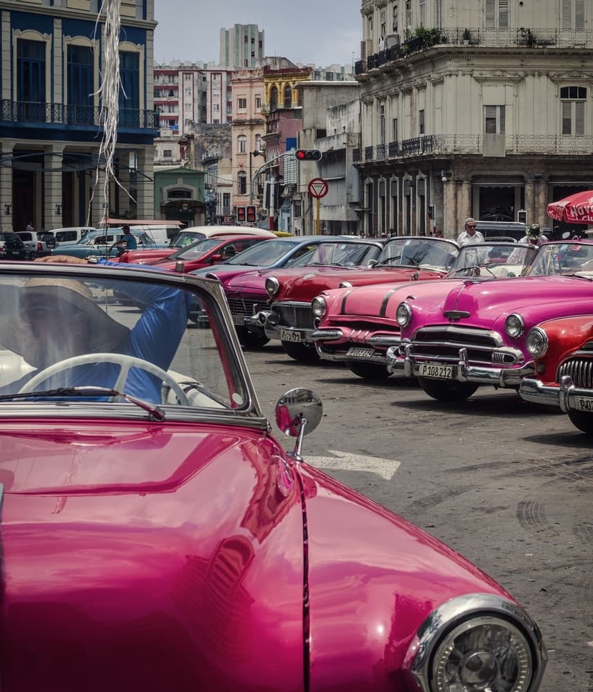 Havana's Pink Classic Cars by Pavol Stranak — canvas wall art