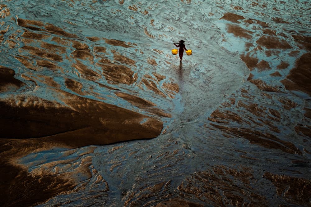 Lone Figure Mudflats by Wei Xu — canvas wall art