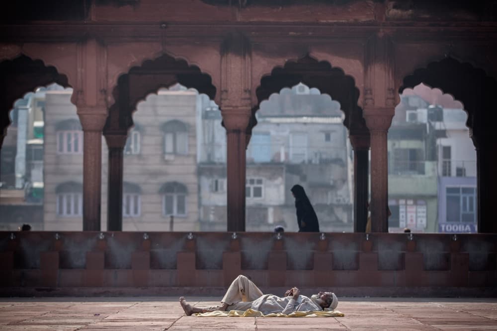 Man Resting Mosque Courtyard by Luís Godinho — canvas wall art